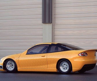 Chevrolet Cavalier Yellow Modified Side And Rear Wallpaper